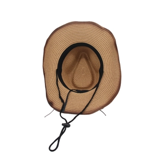 Top view of brown straw cowboy hat interior showing sweatband and adjustable drawstring