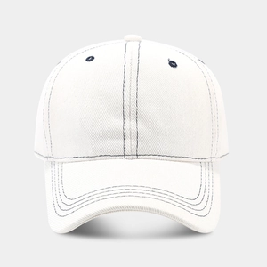 Detail of white cotton baseball cap showing navy contrast stitching and breathable eyelets
