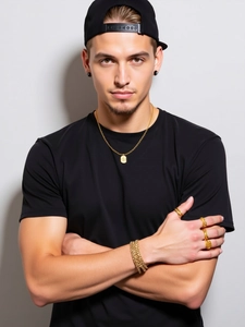 Close-up of a male model wearing a gold pendant necklace with minimalist jewelry set