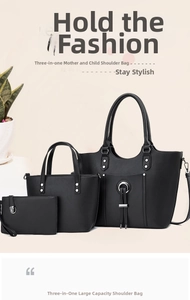 Detail view of black 3-in-1 tote bag set with silver ring buckle and tassel pendant