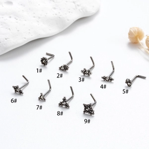 L-shaped stainless steel nose studs in gun black finish with various zircon designs