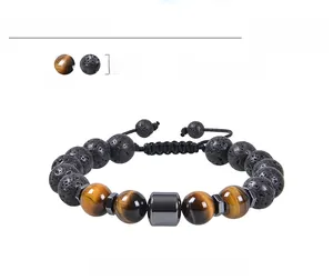 Detail of 10mm lava rock and tiger eye stone beads with adjustable woven strap