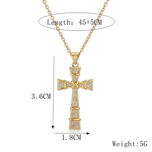 Detailed view of gold cross pendant necklace with clear cubic zirconia and dimensions
