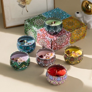 Deluxe gift box featuring six colorful patterned tinplate aromatic candles with floral motifs
