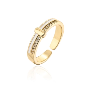 Close-up of gold-plated open ring with white enamel inlay and sparkling zircon stones