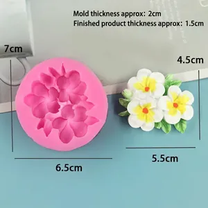 Detailed size view of pink silicone flower mold and finished floral cake decorations