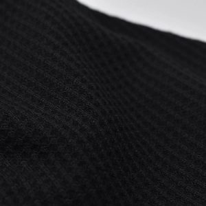 Unisex black waffle knit beanie hat featuring breathable honeycomb texture and soft fabric