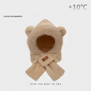 Detail of plush beige hooded scarf with bear ears and soft faux fur texture for winter