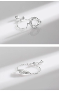 Detail of adjustable S925 silver ring featuring sparkling zircon feather and round charms