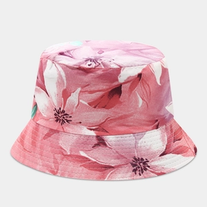 Close-up of pink tropical flower pattern and reinforced stitching on the wide brim sun hat