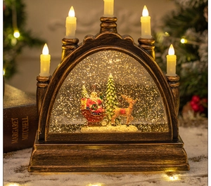 Detail of vintage copper Christmas lantern with Santa model and glowing LED candles