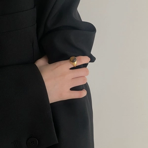Gold-plated S925 sterling silver signet ring with brown tiger eye stone on model hand