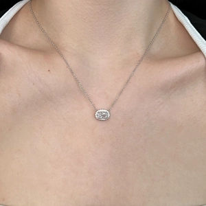 Close-up of S925 silver necklace featuring an oval ice-cut cubic zirconia pendant