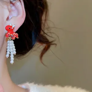 Red enamel dragon stud earring with white pearl tassels and silver needle in Chinese style