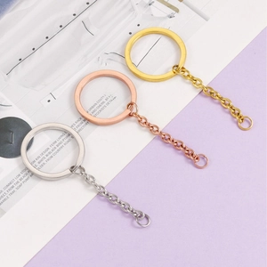 Close-up of 30mm flat stainless steel keychains in gold, rose gold and silver finishes
