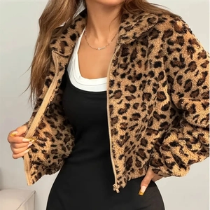 Detailed macro view of the leopard print faux fur texture and zipper on this cropped jacket