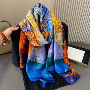 Abstract oil painting style floral silk scarf featuring vibrant orange and blue print patterns