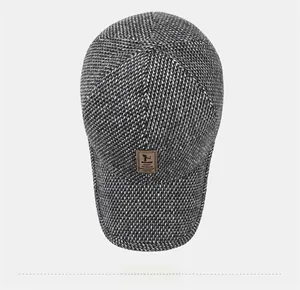 Top view of grey textured wool baseball cap with ear flaps for winter outdoor warmth