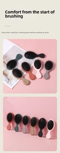 Close-up of boar bristle cushion brush teeth with round tips for scalp massage