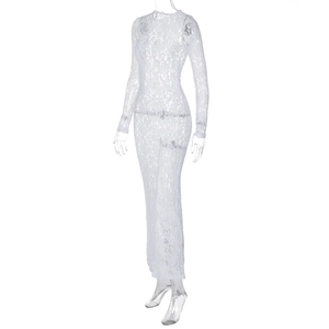 Detailed macro view of white floral lace fabric on a long sleeve slim-fit dress