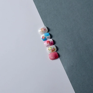 Detail showing cute hand-painted 5pcs press-on nails with strawberry and cake designs