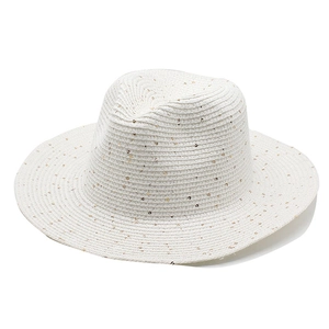 White woven sun hat with gold sequins and wide brim for summer beach vacations