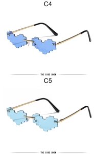 Detail of pixel heart sunglasses in blue and light blue with gold metal frames
