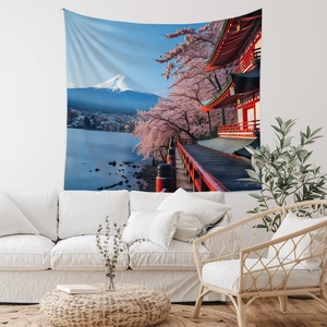 Detail of Mount Fuji tapestry with cherry blossoms hanging over a modern white sofa