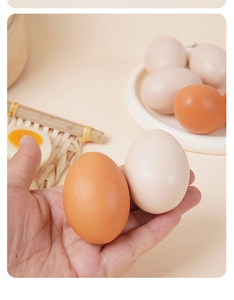 Close-up of realistic artificial egg models in various natural shades for display