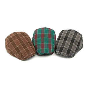 Three British style plaid flat caps in brown, red, and grey wool blend textures