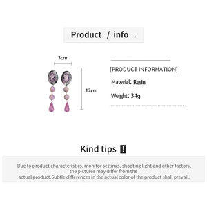 Detail view of resin oval portrait earrings with size dimensions 12cm by 3cm