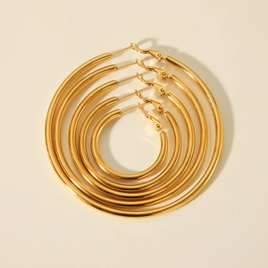 Five sizes of 18K gold plated stainless steel hoop earrings arranged in size order