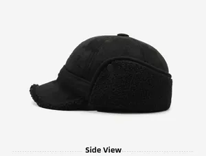 Detail view of winter black trapper hat featuring faux suede fabric and warm fleece lining