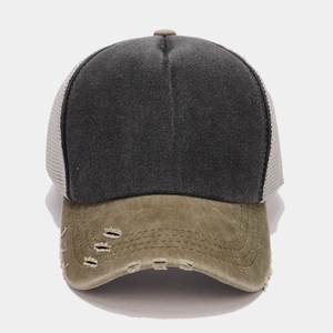 Detail of distressed olive green and grey mesh trucker hat with torn brim effect
