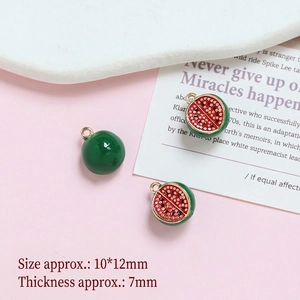 Detailed close-up of 10x12mm gold-plated watermelon charms for DIY jewelry making