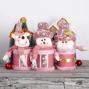 Scatole di caramelle natalizie rosa con lustrini e figure di Babbo Natale e pupazzo