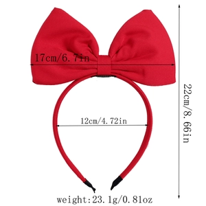 Detail view of red Christmas bow headband with dimensions 17cm width and 22cm height