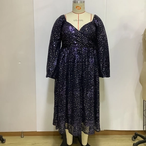 Detail of plus size purple sequined dress with gold star patterns and V-neckline
