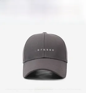 Close-up of dark grey cotton baseball cap featuring narason white embroidery and curved brim