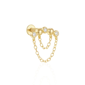 Close-up of 925 silver gold-plated stud earring with sparkling stones and dangling chains