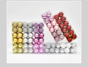 Close-up of assorted plastic Christmas baubles in matte, shiny, and glittery finishes
