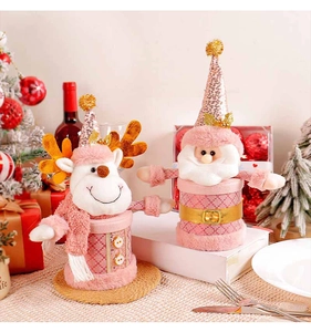 Close-up of pink Christmas gift jars featuring reindeer and Santa with sequins and velvet