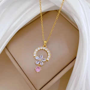 Floral titanium steel necklace featuring gold-plated round ring and pink zircon tassel