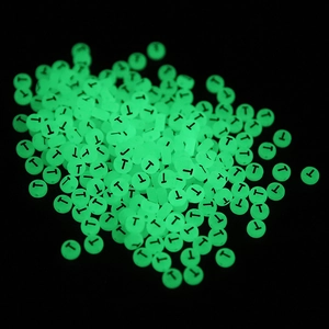 Luminous round beads 7x4mm with black letter T glowing bright green in the dark