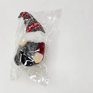 Christmas gnome plush doll weight measurement of 242 grams on a digital scale