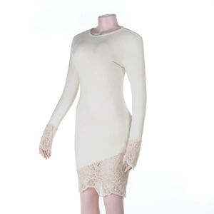 Detailed view of off-white knit dress featuring delicate lace trim on cuffs and hemline