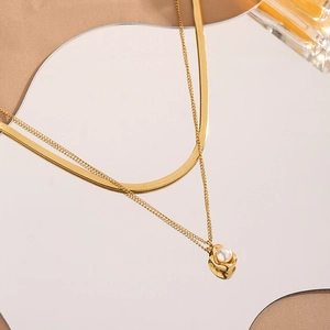 Golden double-layer titanium steel necklace with snake chain and a pearl pendant