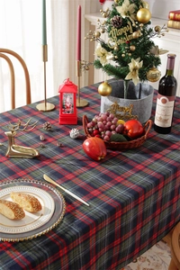 Close-up of thick festive red and green plaid tablecloth with high-quality woven texture