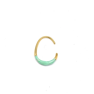 Detailed macro view of mint green marble oil drip on 18K gold-plated U-shaped earrings