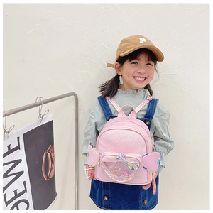 Pink kids sequin backpack detail with transparent heart pocket and side wing designs